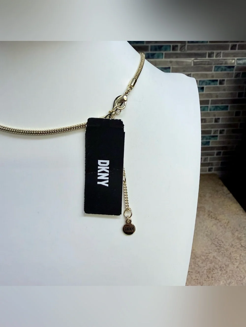NWT DKNY gold tone and rhinestone statement necklace